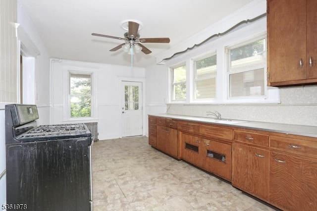 267 Hoover Ave, Bloomfield Twp, NJ 07003 - kitchen with range with gas cooktop, ceiling fan, and brown cabinets