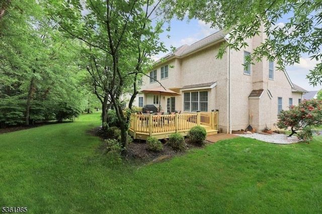 7 Watchung Dr, Bernards Twp, NJ 07920 - rear view of house featuring stucco siding, a wooden deck, and a lawn