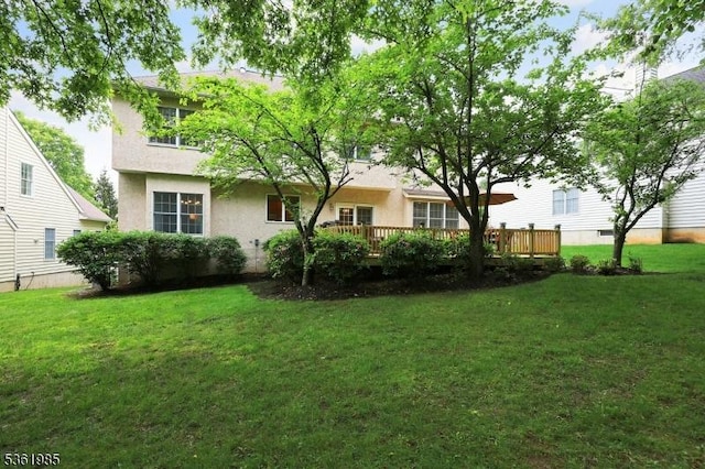 7 Watchung Dr, Bernards Twp, NJ 07920 - rear view of house with a yard, a deck, and stucco siding