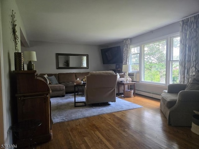 38 Weldon Rd, Jefferson Twp, NJ 07849 - living area with dark wood-style flooring and a baseboard radiator