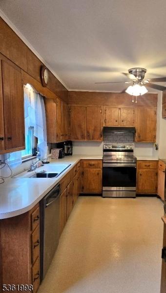 355 State Route 94, Fredon Twp, NJ 07860 - kitchen with appliances with stainless steel finishes, brown cabinets, light countertops, and a ceiling fan