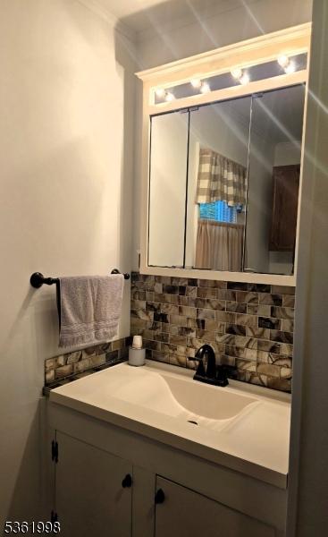 355 State Route 94, Fredon Twp, NJ 07860 - bathroom featuring vanity and tasteful backsplash
