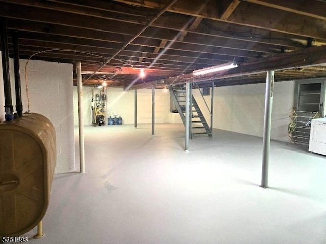 355 State Route 94, Fredon Twp, NJ 07860 - unfinished basement featuring heating fuel, stairway, and washer / clothes dryer
