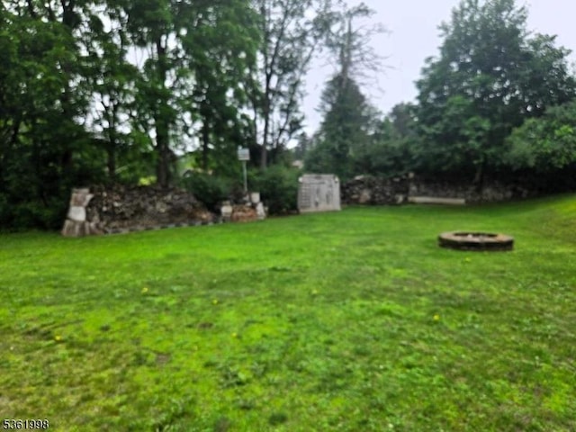 355 State Route 94, Fredon Twp, NJ 07860 - view of grassy yard with a fire pit and a storage shed