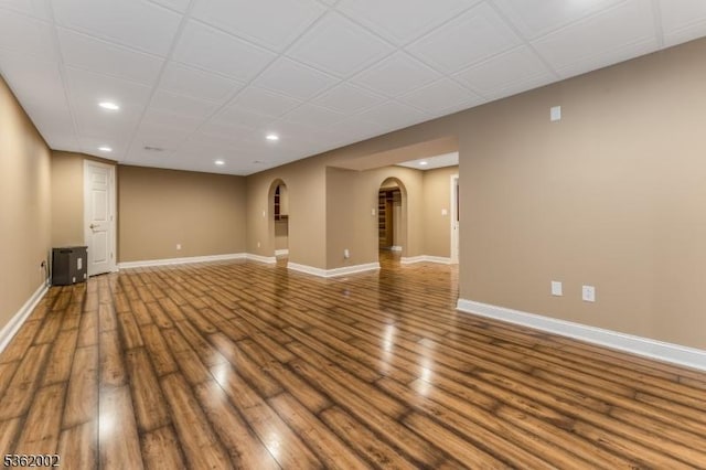 2 Moore Dr, Raritan Twp, NJ 08822 - empty room featuring arched walkways, recessed lighting, wood finished floors, and baseboards