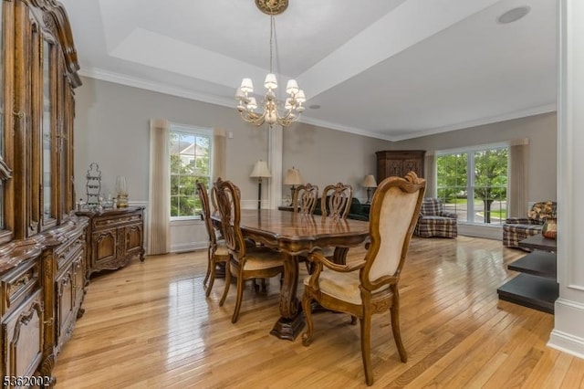 2 Moore Dr, Raritan Twp, NJ 08822 - dining room featuring light wood-style floors, a chandelier, a tray ceiling, and ornamental molding