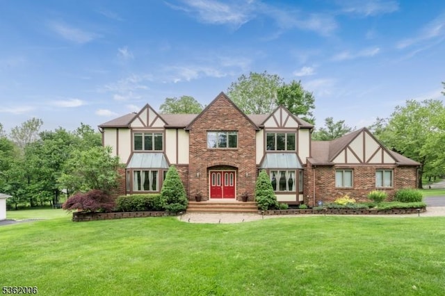 5 Mariner Dr, Randolph Twp, NJ 07869 - tudor-style house featuring a front lawn, brick siding, and stucco siding