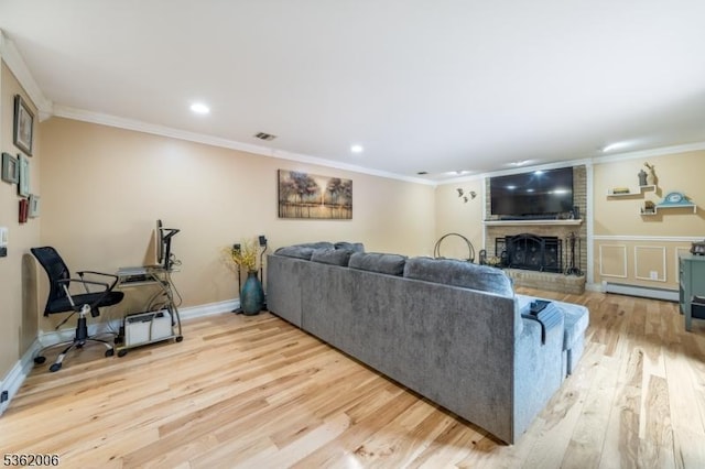 5 Mariner Dr, Randolph Twp, NJ 07869 - living room with light wood-style floors, ornamental molding, a baseboard heating unit, a fireplace, and recessed lighting