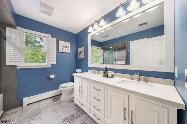 5 Mariner Dr, Randolph Twp, NJ 07869 - full bathroom with a baseboard heating unit, baseboards, a shower with door, double vanity, and toilet