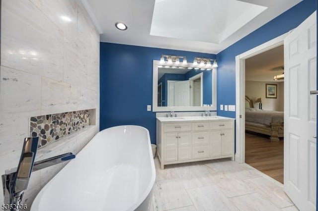 5 Mariner Dr, Randolph Twp, NJ 07869 - ensuite bathroom featuring double vanity, a freestanding bath, and a tray ceiling