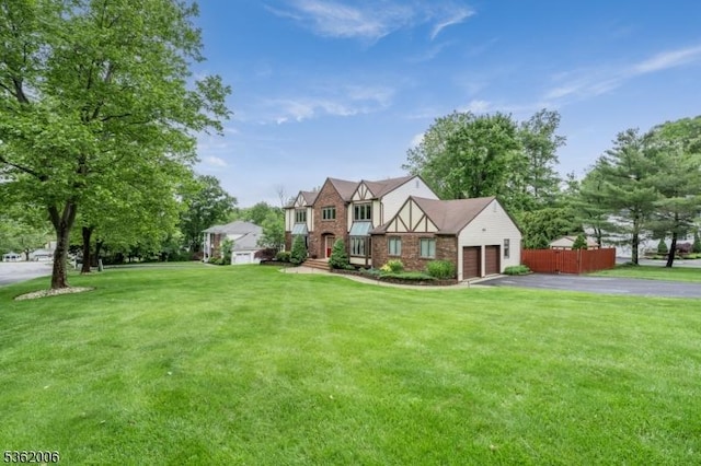 5 Mariner Dr, Randolph Twp, NJ 07869 - tudor-style house featuring asphalt driveway, a garage, and brick siding
