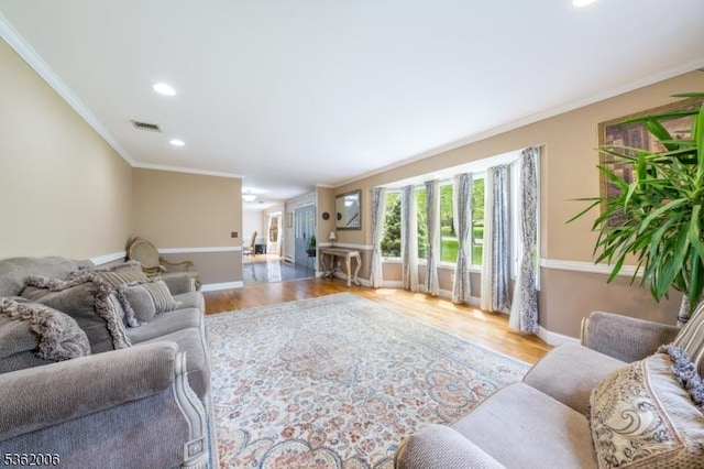 5 Mariner Dr, Randolph Twp, NJ 07869 - living area with crown molding, wood finished floors, baseboards, and recessed lighting