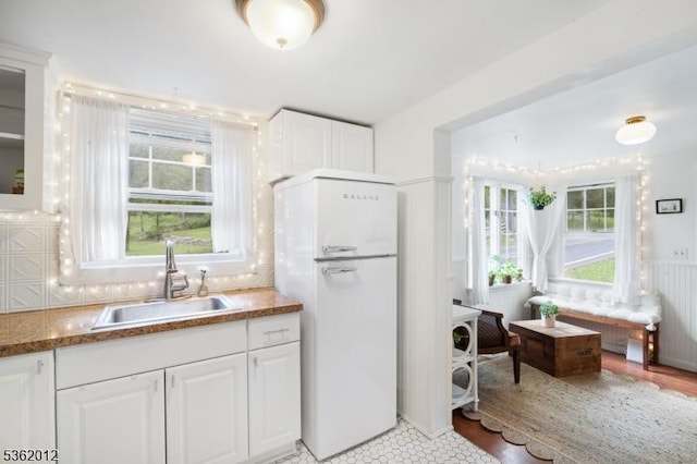 902 Mount Benevolence Rd, Stillwater Twp, NJ 07860 - kitchen featuring freestanding refrigerator, a sink, white cabinetry, and glass insert cabinets