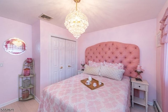 36 Glenroy Rd, Fairfield Twp, NJ 07004 - bedroom featuring a baseboard heating unit, a chandelier, wood finished floors, baseboards, and a closet
