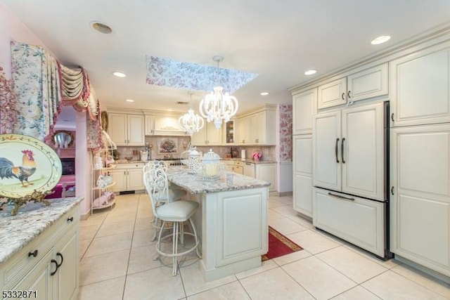 36 Glenroy Rd, Fairfield Twp, NJ 07004 - kitchen featuring paneled fridge, cream cabinetry, a chandelier, light tile patterned floors, and recessed lighting