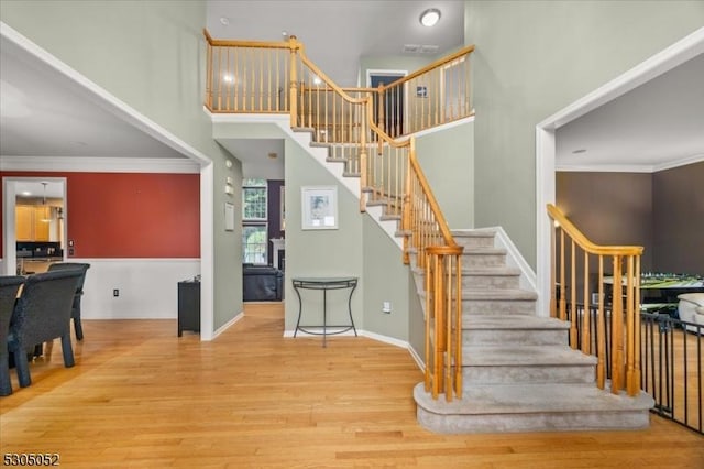 14 Barn Swallow Ct, Greenwich Twp, NJ 08886 - stairway featuring wood finished floors, a high ceiling, baseboards, and crown molding