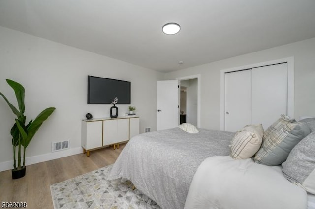 144 Elm St, Rockaway Twp, NJ 07801 - bedroom featuring light wood-style flooring, a closet, and baseboards