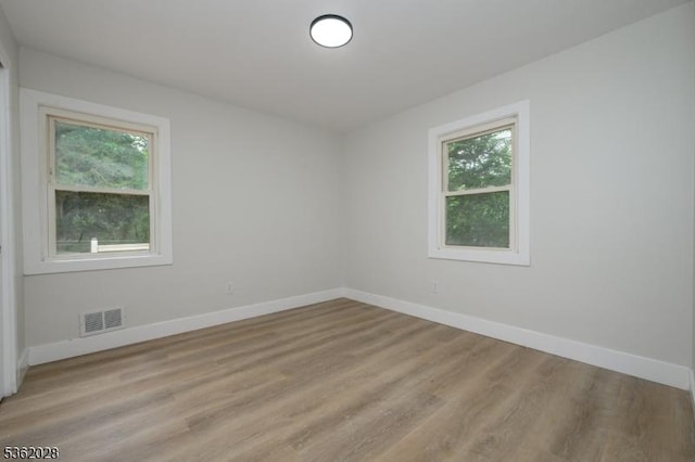 144 Elm St, Rockaway Twp, NJ 07801 - spare room featuring baseboards, plenty of natural light, and light wood-style floors