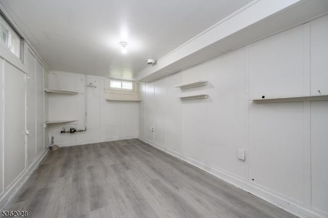 144 Elm St, Rockaway Twp, NJ 07801 - basement with light wood-style flooring and a decorative wall