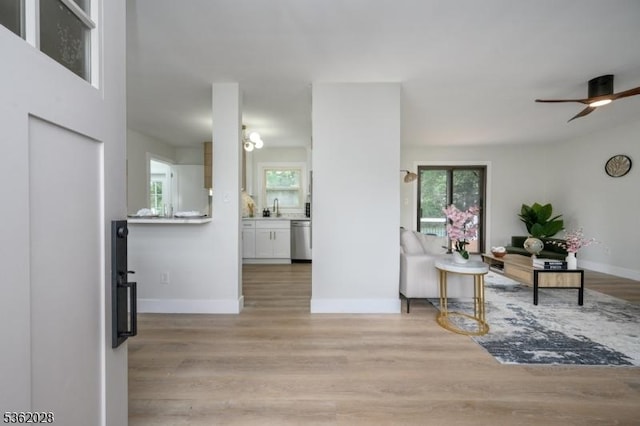 144 Elm St, Rockaway Twp, NJ 07801 - living area featuring light wood-style flooring, ceiling fan, and baseboards