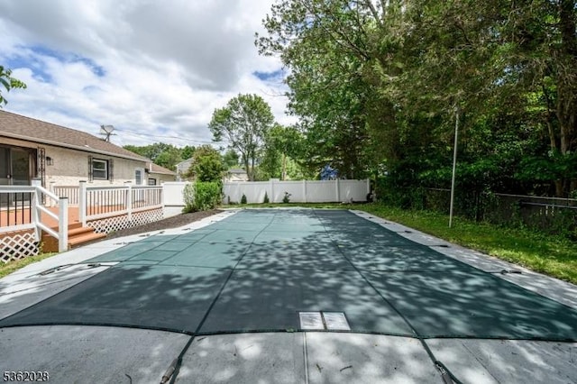144 Elm St, Rockaway Twp, NJ 07801 - view of swimming pool with a deck and a fenced backyard