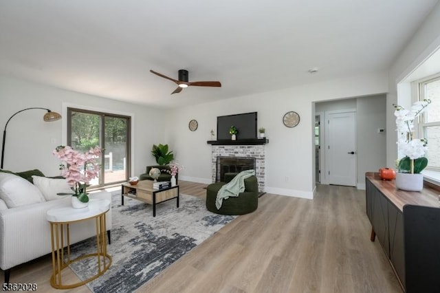 144 Elm St, Rockaway Twp, NJ 07801 - living area featuring wood finished floors, a fireplace, ceiling fan, and baseboards