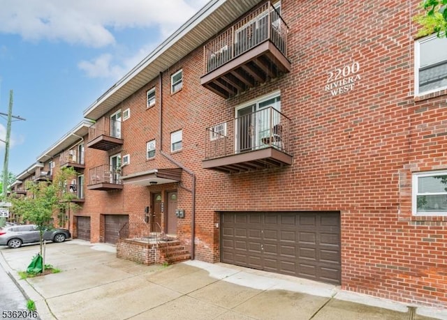 2200 Paterson Plank Rd Unit 23, North Bergen Twp, NJ 07047 - view of property with an attached garage and driveway