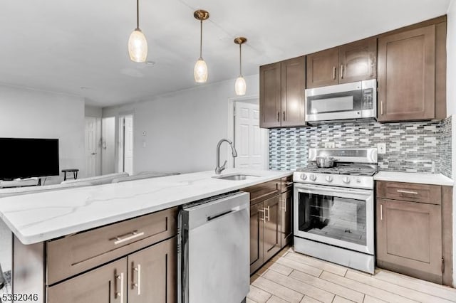 2200 Paterson Plank Rd Unit 23, North Bergen Twp, NJ 07047 - kitchen featuring stainless steel appliances, a sink, backsplash, pendant lighting, and open floor plan