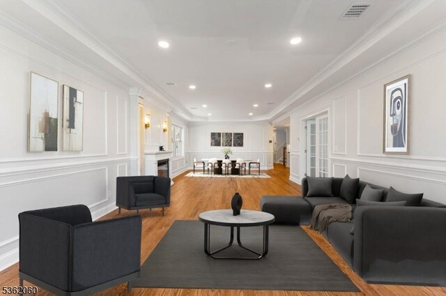 1537 Franklin St, Clark Twp, NJ 07066 - living room featuring a decorative wall, ornamental molding, wood finished floors, and recessed lighting
