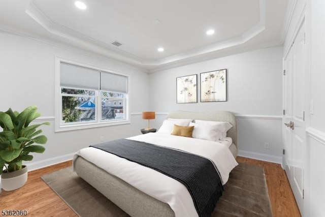 1537 Franklin St, Clark Twp, NJ 07066 - bedroom featuring a tray ceiling, crown molding, wood finished floors, recessed lighting, and baseboards