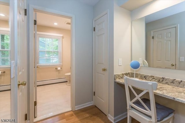 31 Winay Ter, Washington Twp, NJ 07853 - bathroom featuring baseboard heating, wood finished floors, recessed lighting, and vanity