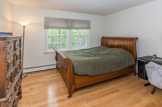 31 Winay Ter, Washington Twp, NJ 07853 - bedroom featuring baseboard heating and light wood-style floors