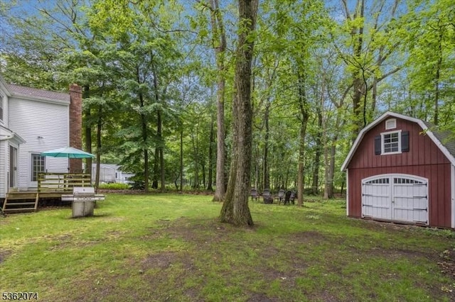 31 Winay Ter, Washington Twp, NJ 07853 - view of green lawn with an outbuilding, a garage, a wooden deck, and a barn