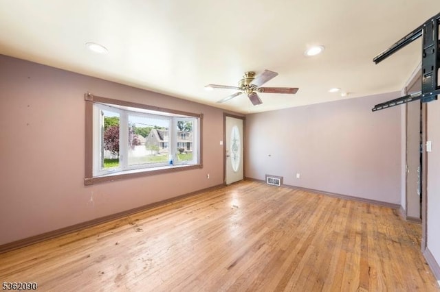 1236 Mayfair Dr, Rahway City, NJ 07065 - spare room with a barn door, light wood-type flooring, a ceiling fan, baseboards, and recessed lighting