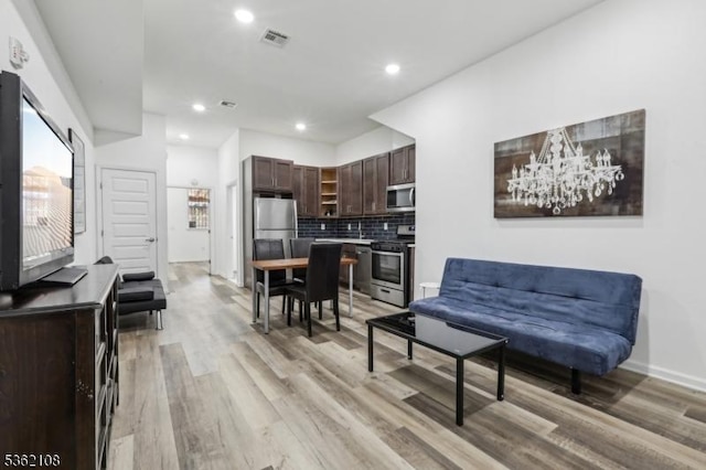 430 Ocean Ave, Jersey City, NJ 07305 - living room featuring light wood-style flooring, recessed lighting, and baseboards