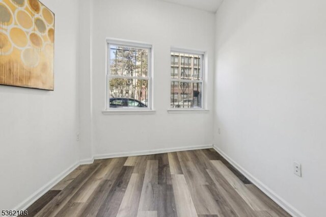 430 Ocean Ave, Jersey City, NJ 07305 - spare room featuring wood finished floors and baseboards
