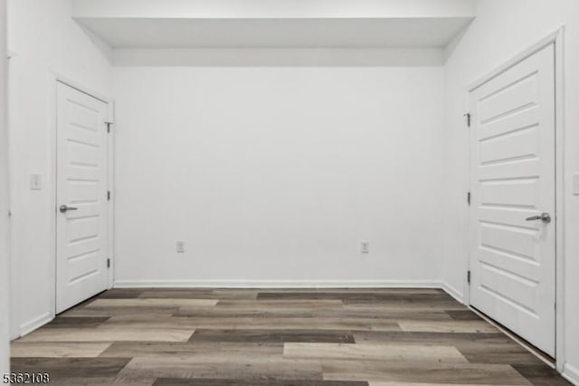 430 Ocean Ave, Jersey City, NJ 07305 - unfurnished bedroom with wood finished floors and baseboards