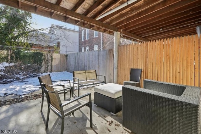 430 Ocean Ave, Jersey City, NJ 07305 - snow covered patio featuring a patio area, an outdoor living space, and a fenced backyard