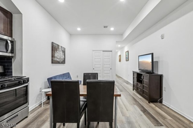 430 Ocean Ave, Jersey City, NJ 07305 - dining area with light wood-style flooring, recessed lighting, and baseboards