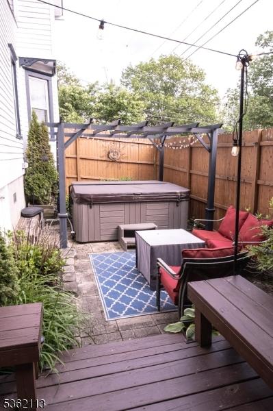 24 Ryerson Ave, Newton Town, NJ 07860 - wooden deck featuring a hot tub and a fenced backyard