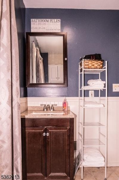 24 Ryerson Ave, Newton Town, NJ 07860 - bathroom with wainscoting, vanity, and a decorative wall