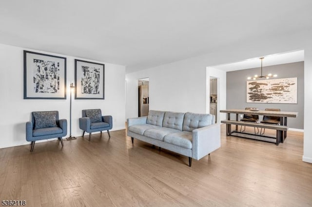 1105 Essex Ave Unit 2, Linden City, NJ 07036 - living area featuring a chandelier, wood finished floors, and baseboards