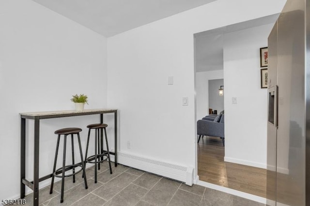 1105 Essex Ave Unit 2, Linden City, NJ 07036 - hallway with baseboard heating, baseboards, and tile patterned floors