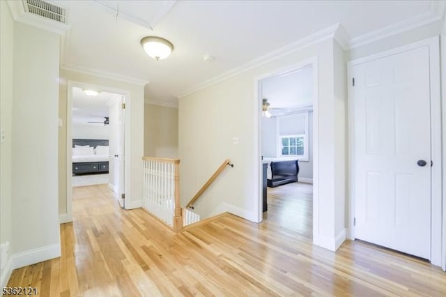 17 Olsen Dr, Warren Twp, NJ 07059 - hallway with an upstairs landing, light wood-style flooring, crown molding, and baseboards