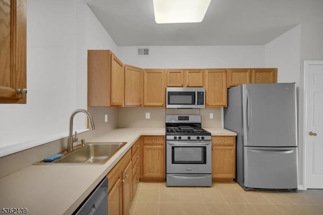 231 Swathmore Dr, Nutley Twp, NJ 07110 - kitchen with appliances with stainless steel finishes, light countertops, and light tile patterned flooring
