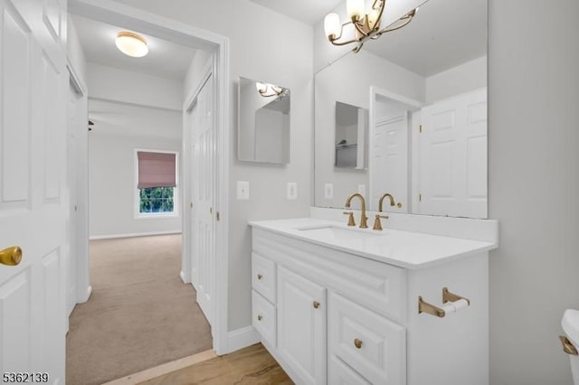 231 Swathmore Dr, Nutley Twp, NJ 07110 - bathroom with vanity and a chandelier