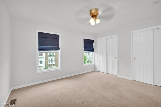 231 Swathmore Dr, Nutley Twp, NJ 07110 - unfurnished bedroom featuring carpet floors, two closets, and a ceiling fan