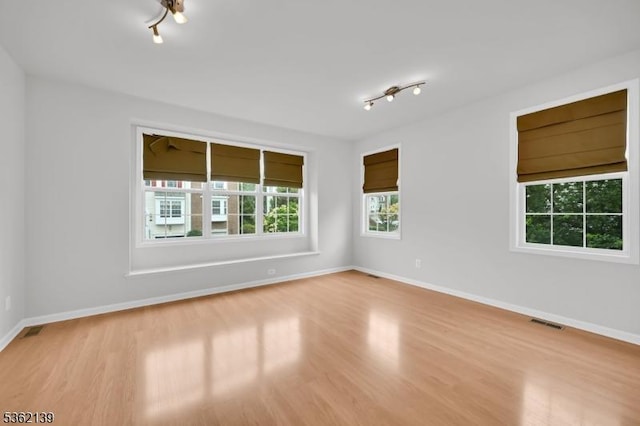 231 Swathmore Dr, Nutley Twp, NJ 07110 - spare room featuring wood finished floors and track lighting