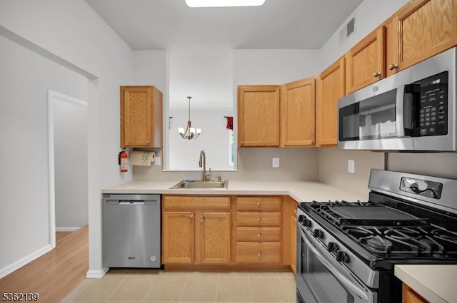 231 Swathmore Dr, Nutley Twp, NJ 07110 - kitchen featuring stainless steel appliances, a chandelier, and light countertops