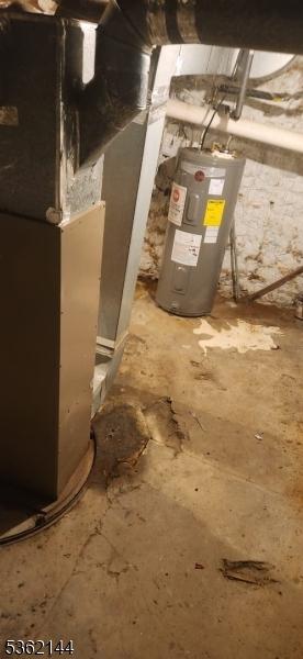 286 Chambers St, Phillipsburg Town, NJ 08865 - utility room with water heater and heating unit